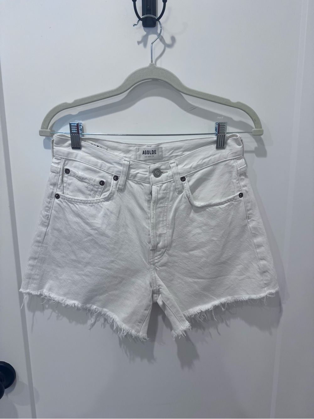 Agolde Parker Long cutoff denim shorts in Panna Cotta